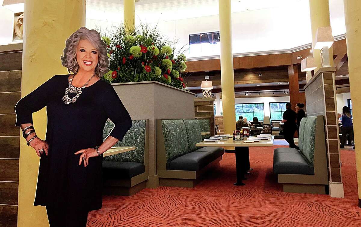 A cutout of Paula Deen greets customers at the towering dining room at Paula Deen's Family Kitchen inside Bass Pro Shops at The Rim in San Antonio.