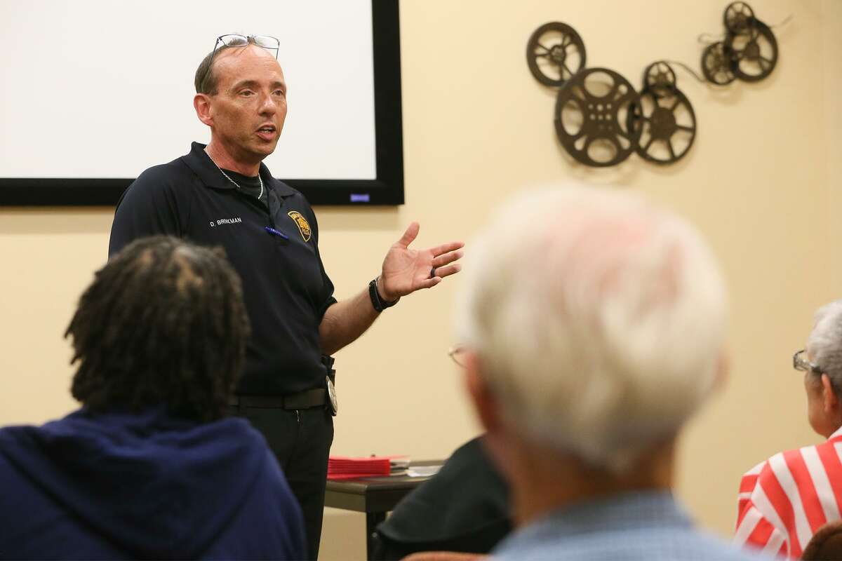 San Antonio Police detective David Brinkman talks about strategies con artists are using to scam seniors in a Monday workshop at the Doris Griffin Senior One-Stop Center.