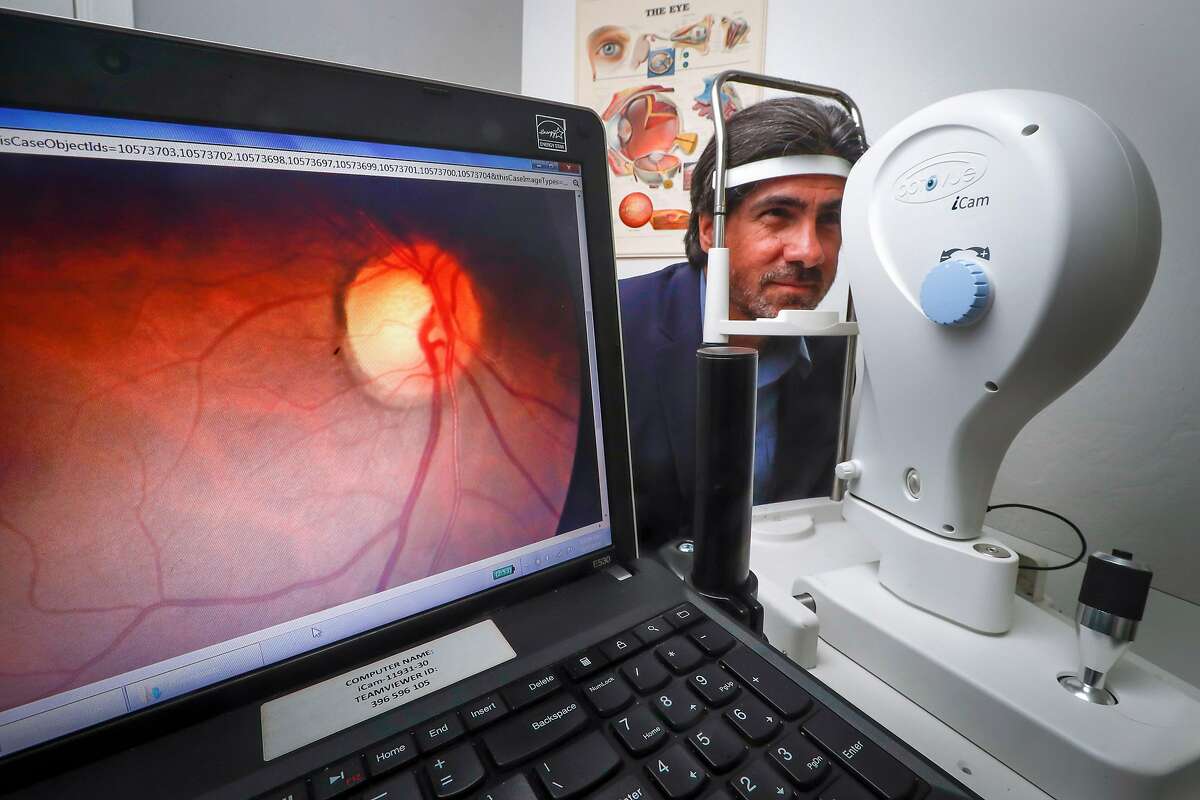 Jorge Cuadros, OD, PhD demonstrates the use of the Optovue iCam a retinal camera at his office in San Jose, California. Monday, May 7, 2018. Cuadros is using Google's AI technology to help determine if patients have diabetic retinopathy, a disease that can cause blindness.