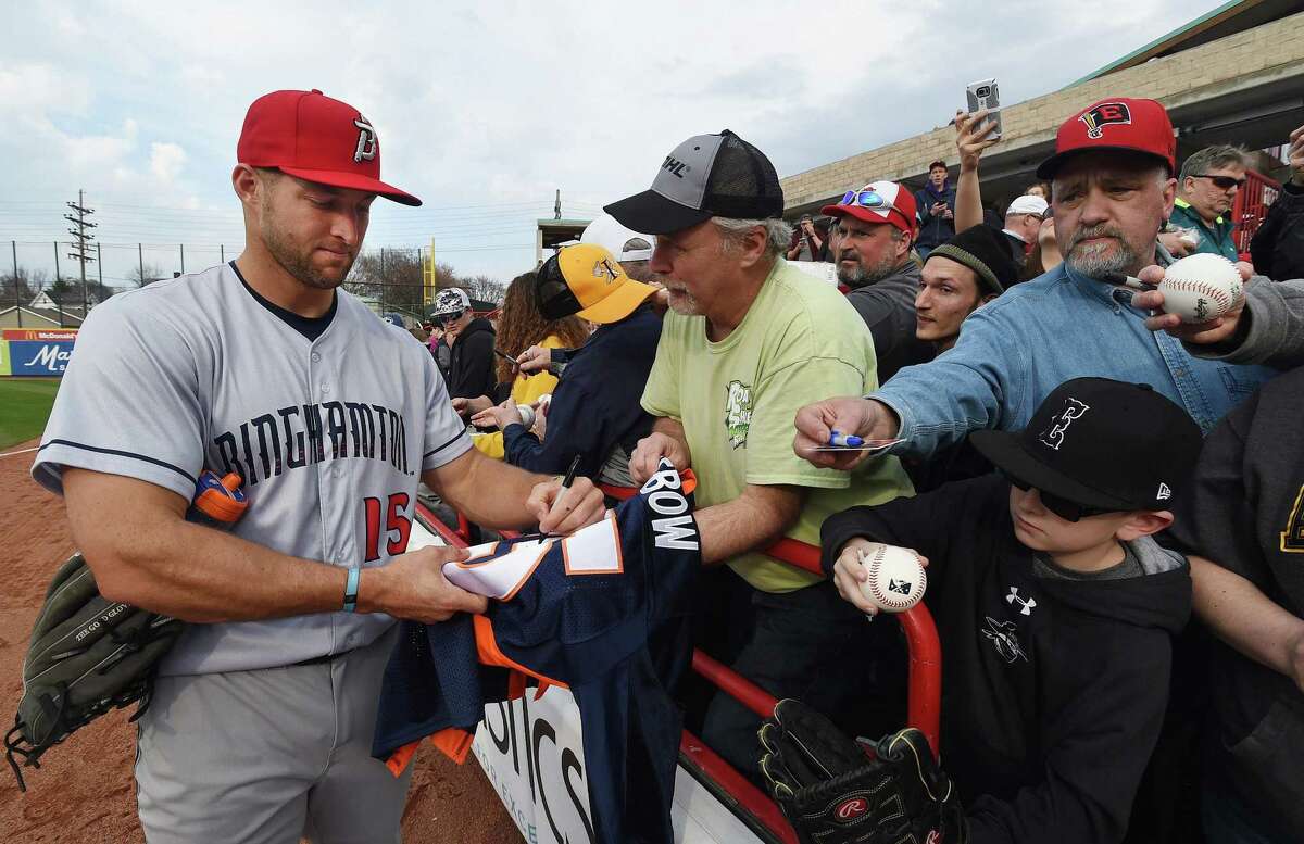 Tim Tebow, playing for the Binghamton Rumble Ponies, signs autographs for fans before the team's Class AA game against the Erie SeaWolves on April 27 in Erie, Pa.