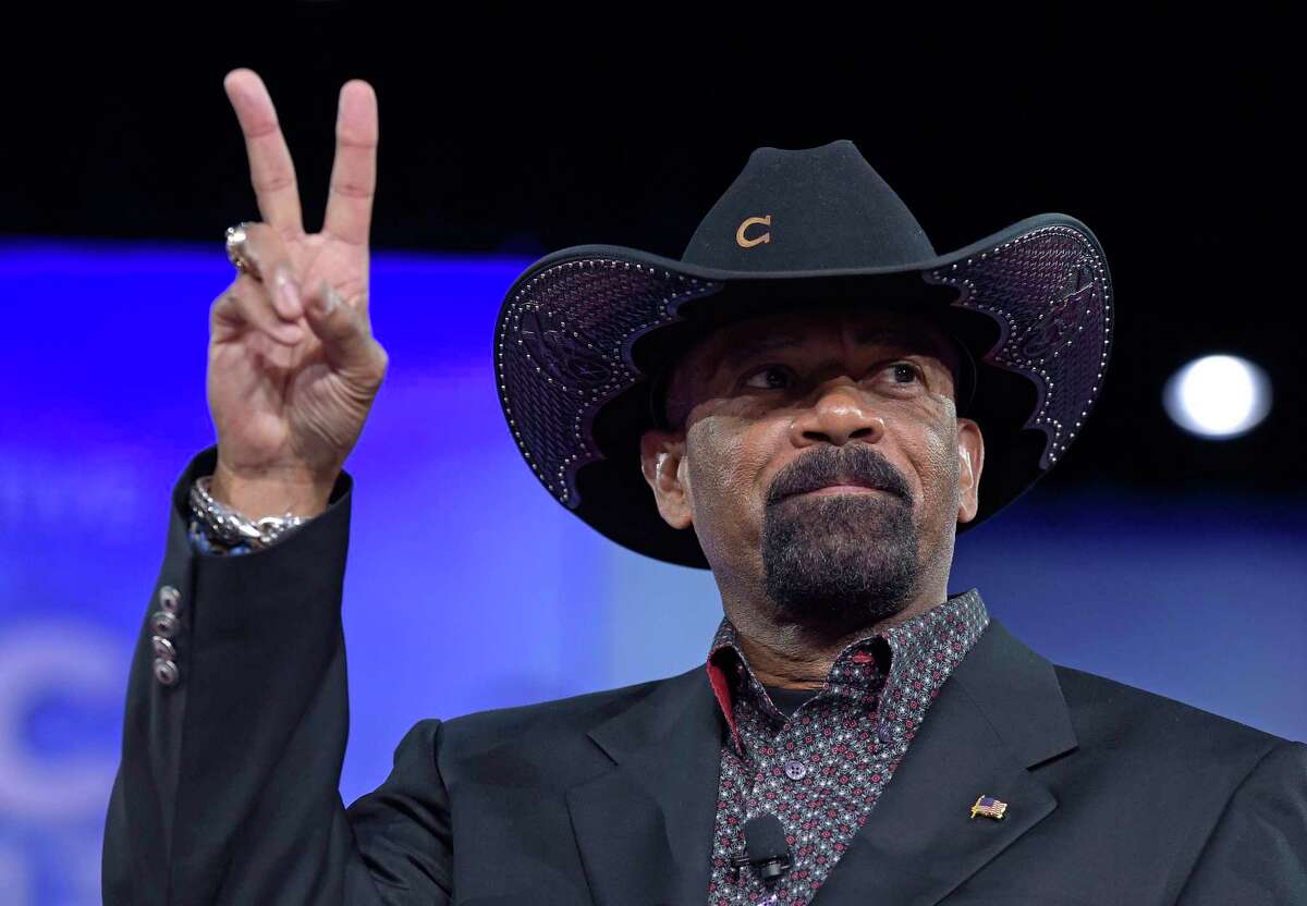 FILE - In this Feb. 23, 2017, file photo, Milwaukee County Sheriff David Clarke speaks at the Conservative Political Action Conference (CPAC) in Oxon Hill, Md. The former Milwaukee County Sheriff David Clarke Jr. will be the keynote speaker Wednesday at the New York State Association of Chiefs of Police?s 2018 Annual Law Enforcement Vendor Exposition. (AP Photo/Susan Walsh, File)
