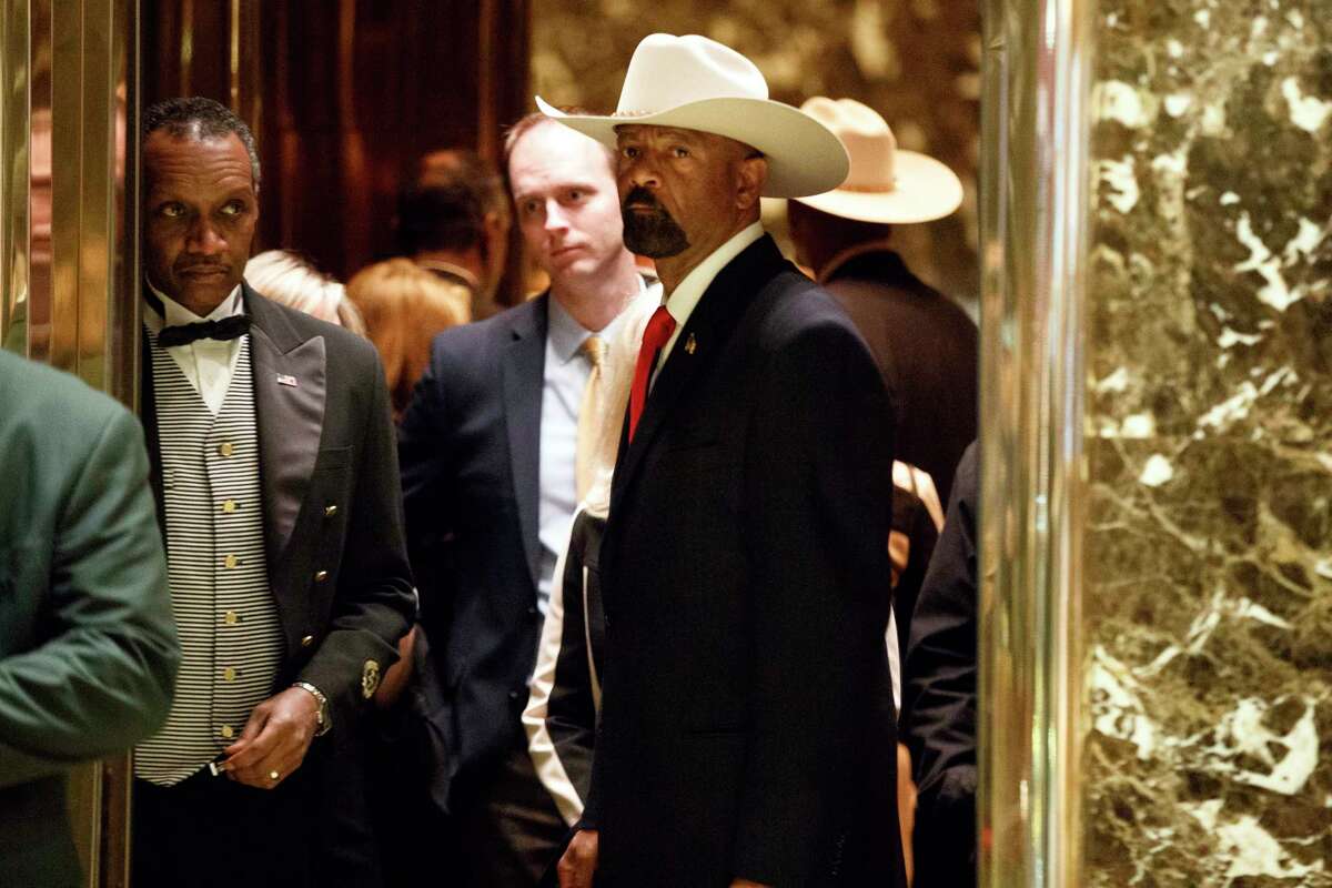 Milwaukee Sheriff David Clarke gets on an elevator after arriving at Trump Tower, Monday, Nov. 28, 2016, in New York. The former Milwaukee County Sheriff David Clarke Jr. will be the keynote speaker Wednesday at the New York State Association of Chiefs of Police?s 2018 Annual Law Enforcement Vendor Exposition. (AP Photo/Evan Vucci)