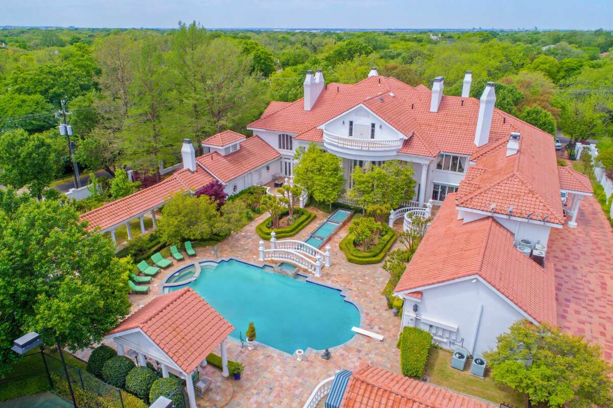 An 18,288 square-foot mansion at 9006 Douglas Ave. is on the market for nearly $13 million. The home comes with eight bedrooms, 8.3 bathrooms and a 822 square-foot guest house.Scroll ahead to see more of the house in the gallery ahead. 