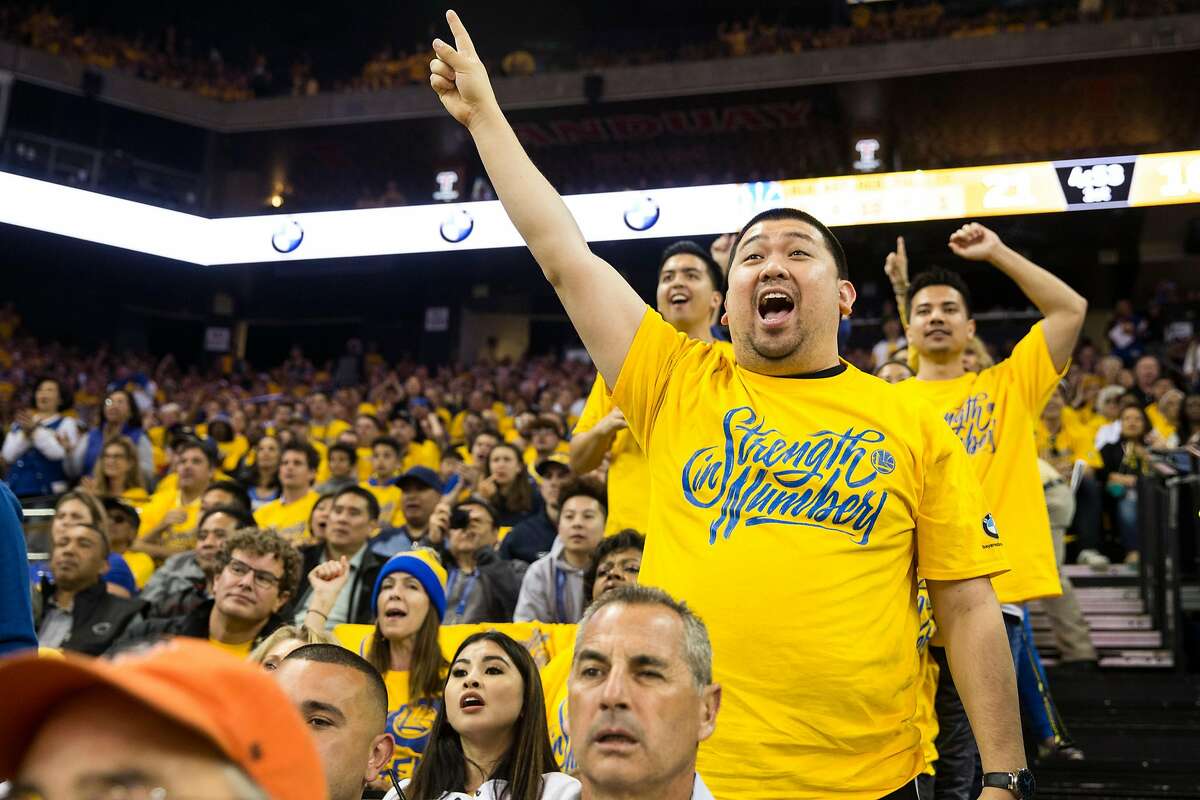 Fans cheer as the Golden State Warriors take on the New Orleans Pelicans during Game 5 of the Western Conference Semifinals at Oracle Arena in Oakland, Calif. Tuesday, May 8, 2018.