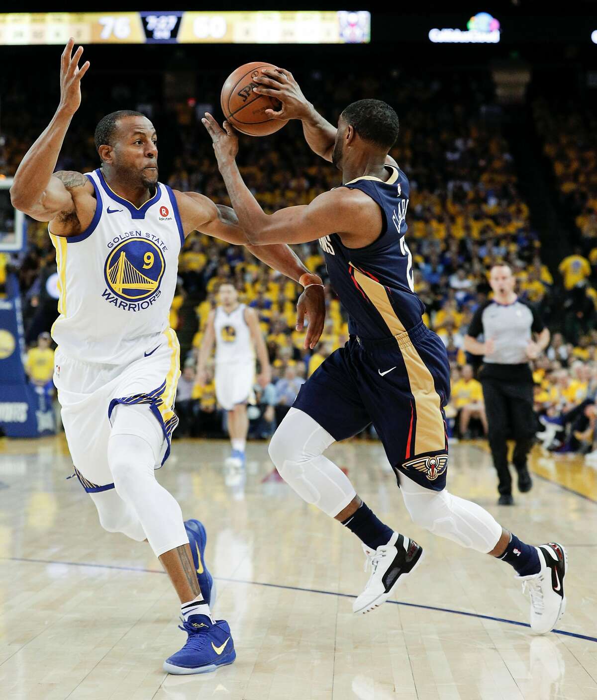 Golden State Warriors' Andre Iguodala defends against New Orleans Pelicans' Ian Clark in the third quarter during game 5 of the Western Conference Semifinals between the Golden State Warriors and the New Orleans Pelicans at Oracle Arena on Tuesday, May 8, 2018 in Oakland, Calif.