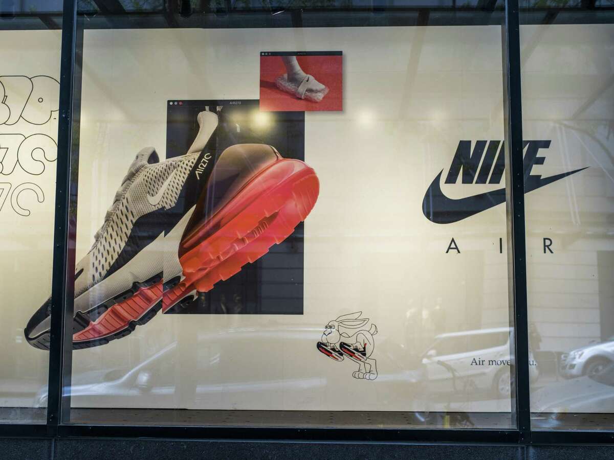FILE A Nike store in Seattle, April 19, 2018. A sweeping investigation into workplace behavior at Nike has resulted in the departure of four more top-level executives as it continues to overhaul its upper ranks amid widespread allegations of harassment and discrimination against female employees.