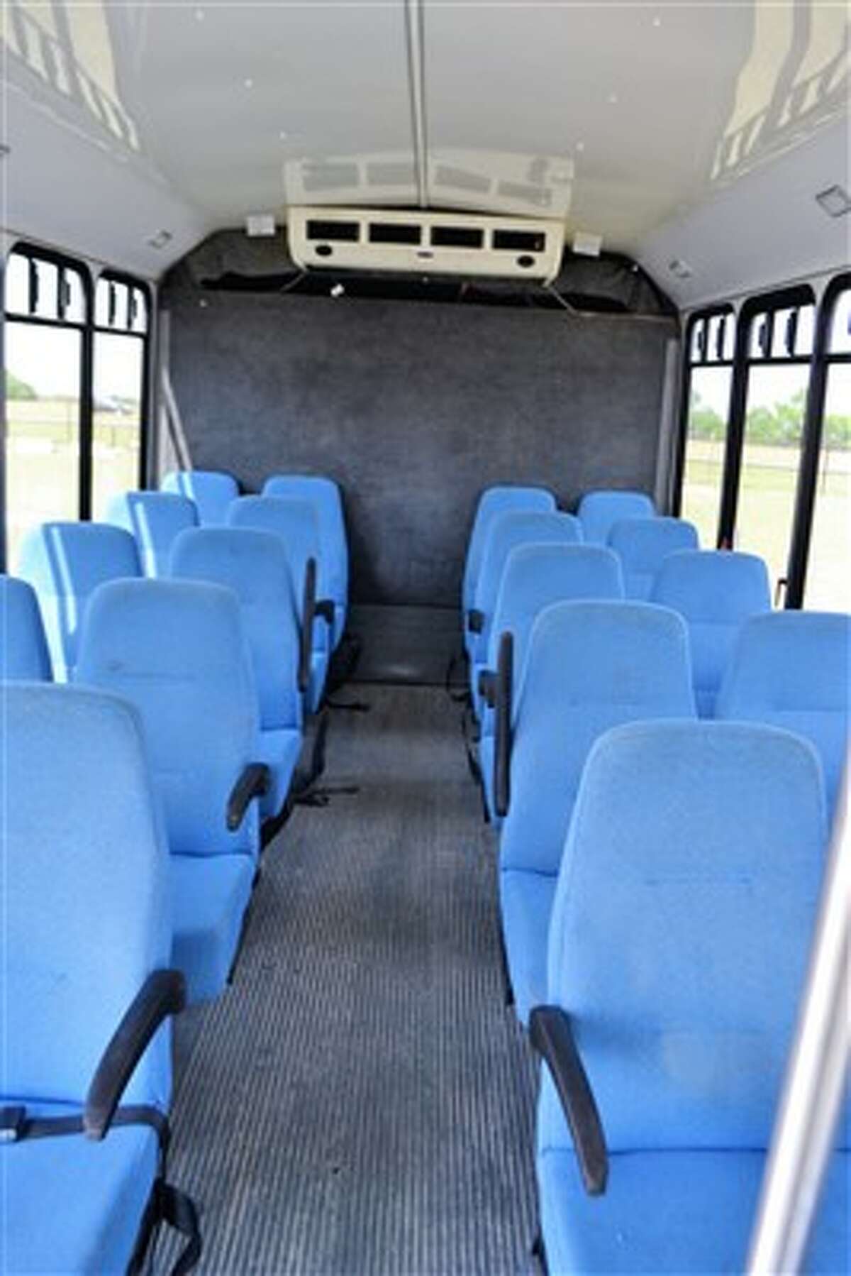 Former airport shuttle buses recently seized from a San Antonio company by Bexar County go on the auction block Wednesday, May 9, 2018. The opening price for each of the vehicles has been set at $1,000.