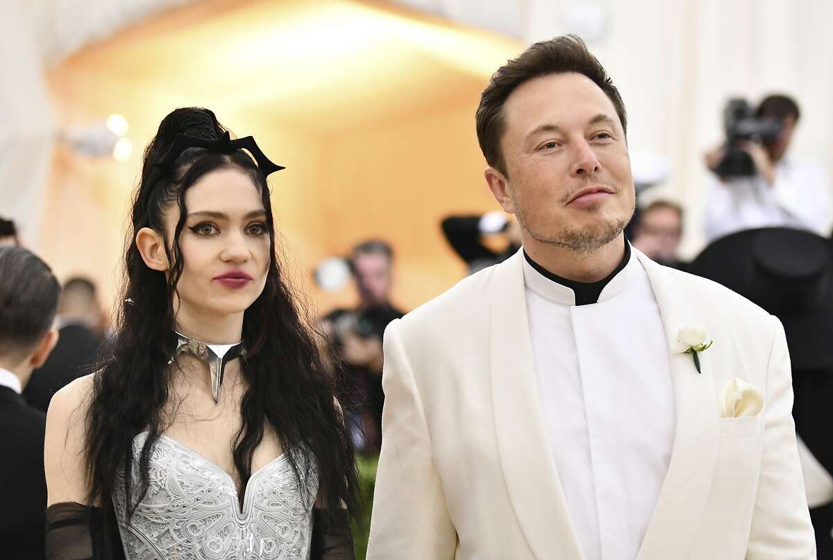 Grimes, left, and Elon Musk attend The Metropolitan Museum of Art's Costume Institute benefit gala celebrating the opening of the Heavenly Bodies: Fashion and the Catholic Imagination exhibition on Monday, May 7, 2018, in New York. (Photo by Charles Sykes/Invision/AP)