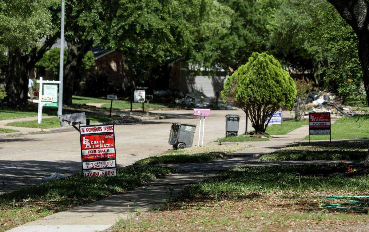 Signs reading "For Rent" and "For Sale" line the streets in the Bear Creek neighborhood, Tuesday, April 17, 2018, in Houston. ( Jon Shapley / Houston Chronicle )