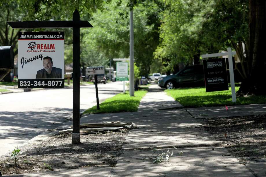 Signs reading "For Rent" and "For Sale" line the streets in the Bear Creek neighborhood, Tuesday, April 17, 2018, in Houston. Photo: Jon Shapley / © 2018 Houston Chronicle