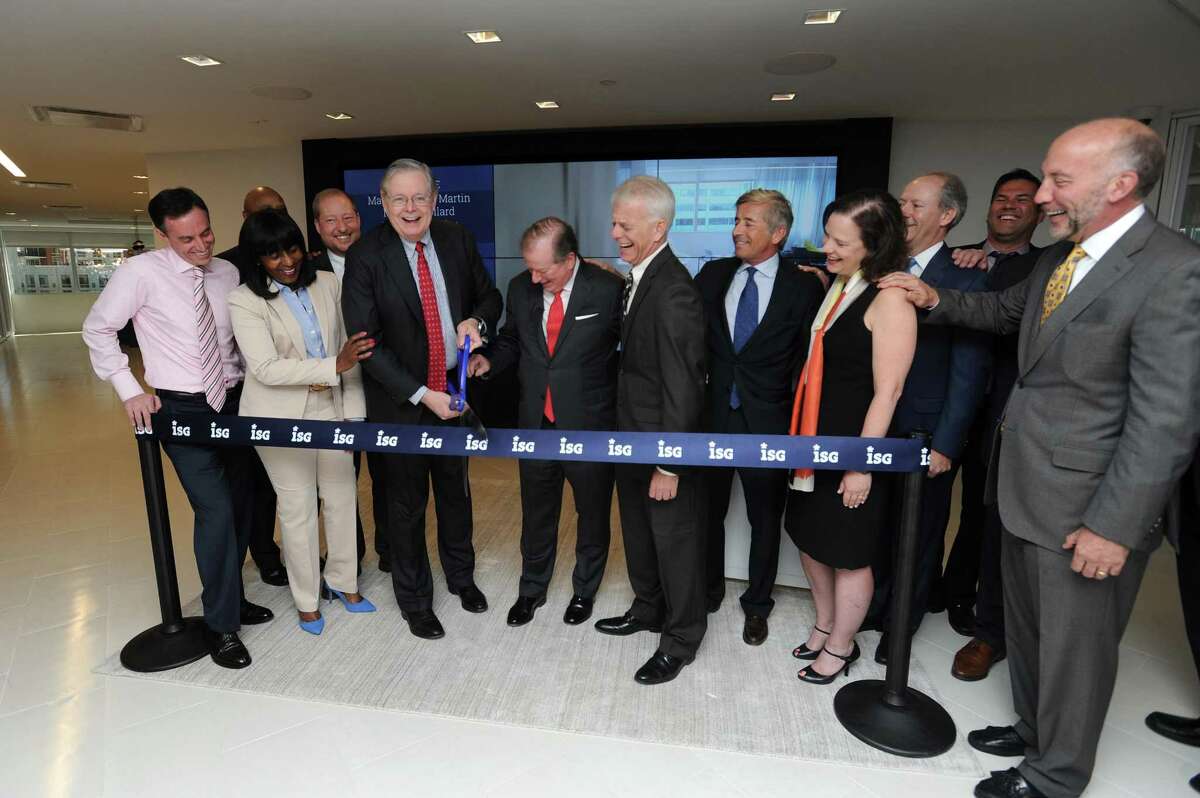 Stamford mayor David Martin (center left) and ISG CEO Michael Connors cut the ceremonial ribbon at the IT consulting and research firm's new offices at 2187 Atlantic St., in the Harbor Point area of Stamford, Conn., on Wednesday, May 9, 2018.