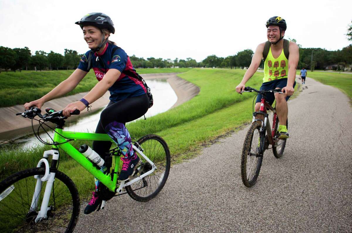 Bicycle riders travel along the trail by the Brays Bayou, Monday, June 20, 2016, in Houston. ( Marie D. De Jesus / Houston Chronicle )