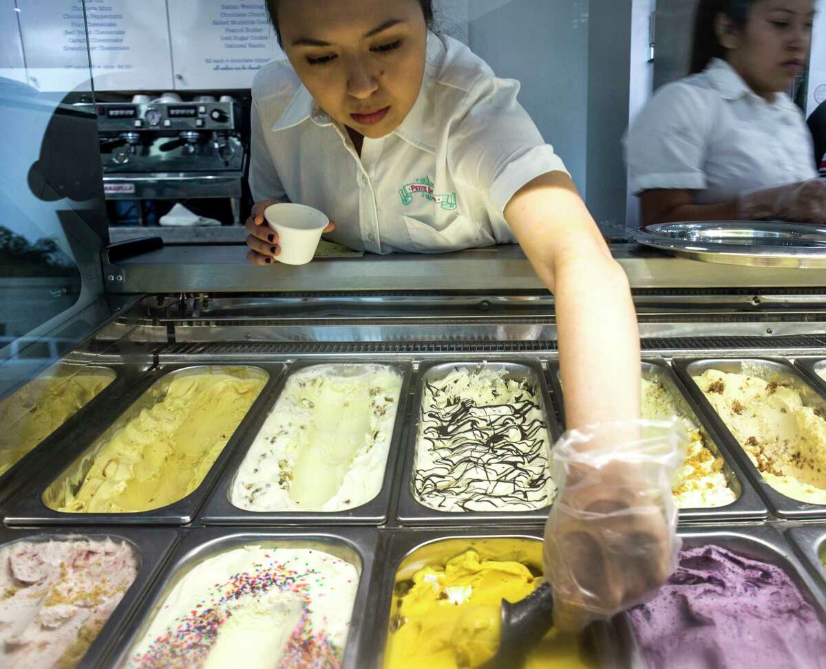 Jamie Dale scoops ice cream at Petite Sweets on Monday, Aug. 15, 2016, in Houston. ( Brett Coomer / Houston Chronicle )