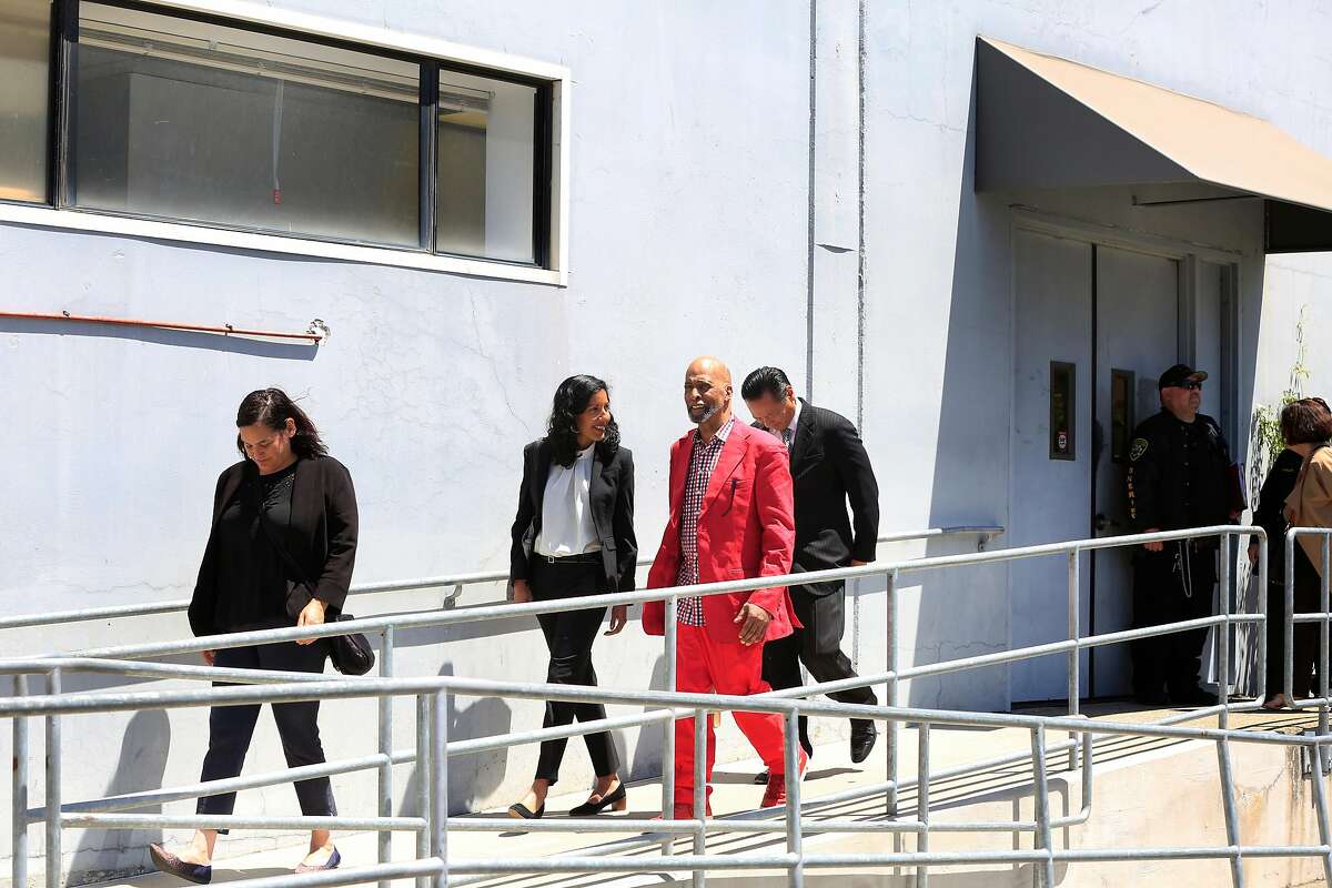 Anita Nabha (second from left), Deputy Public Defender talks with Kenneth Humphrey (third from left) as he leaves the San Francisco Sherriff's Department on Wednesday, May 9, 2018 in San Francisco, Calif. Months after a state appeals court found that Humphrey's $350,000 bail was unconstitutionally excessive because he couldn't come close to affording it, he is being released from jail.