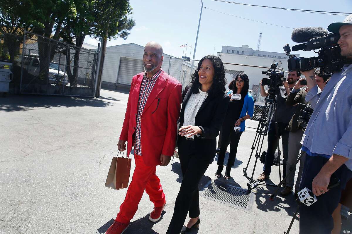 Kenneth Humphrey (l to r) and Anita Nabha, Deputy Public Defender walk back to a transport van after talking with the media at the San Francisco Sheriff's Department on Wedesday, May 9, 2018 in San Francisco, Calif. Months after a state appeals court found that his $350,000 bail was unconstitutionally excessive because he couldn't come close to affording it, Humphrey is released from jail.