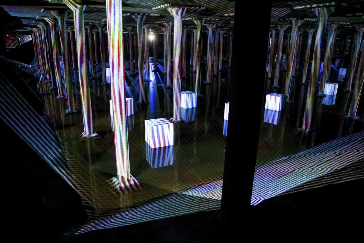 Buffalo Bayou Park Cistern Houston first underground drinking-water reservoir is now open to the public and the “Spatial Chromointerference” light exhibit makes it even more other-worldly.