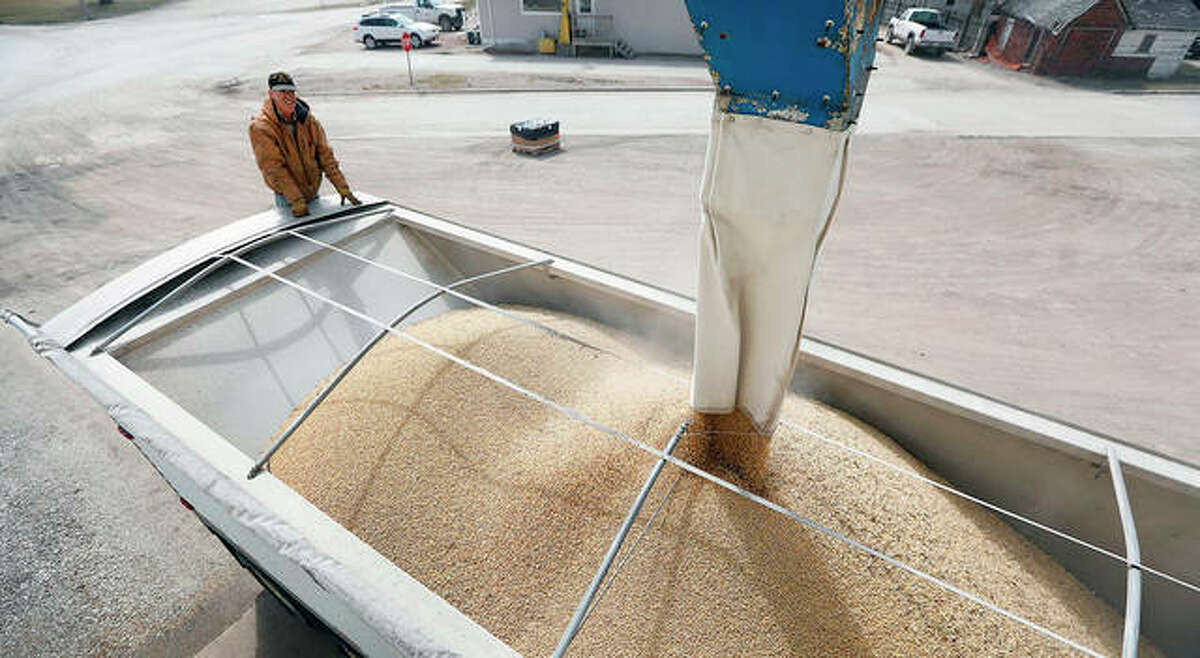 Terry Morrison of Earlham, Iowa, watches as soybeans are loaded into his trailer. With the threat of tariffs and counter-tariffs between Washington and Beijing looming, Chinese buyers are canceling orders for U.S. soybeans, a trend that could deal a blow to American farmers if it continues.