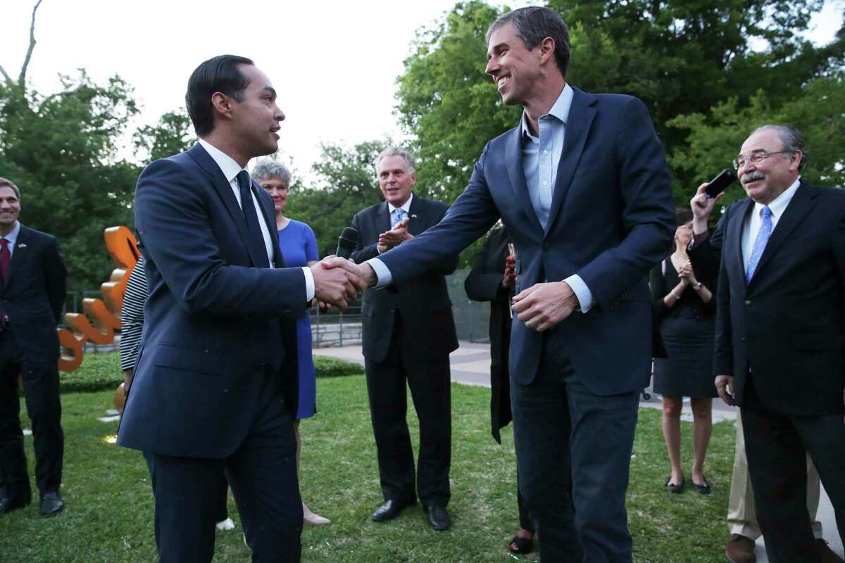 Julian Castro and Beto O'Rourke greet as Democratic statewide hopefuls gather at the Sheraton Austin at the Capitol to speak at the Blue Wave Summit Fundraising reception on April 14, 2018.
