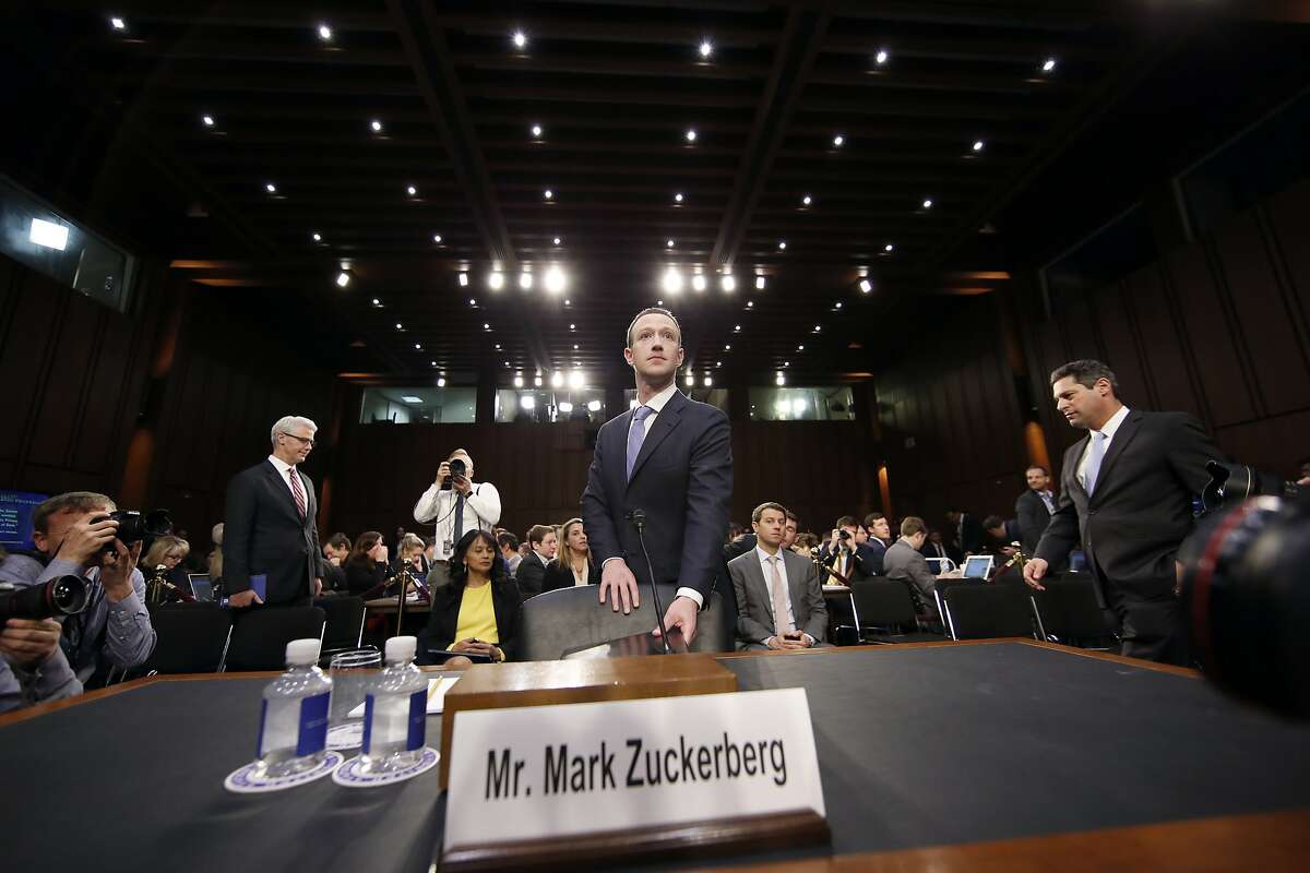 Facebook CEO Mark Zuckerberg arrives after a break to continue to testify before a joint hearing of the Commerce and Judiciary Committees on Capitol Hill in Washington, Tuesday, April 10, 2018, about the use of Facebook data to target American voters in the 2016 election. (AP Photo/Alex Brandon)