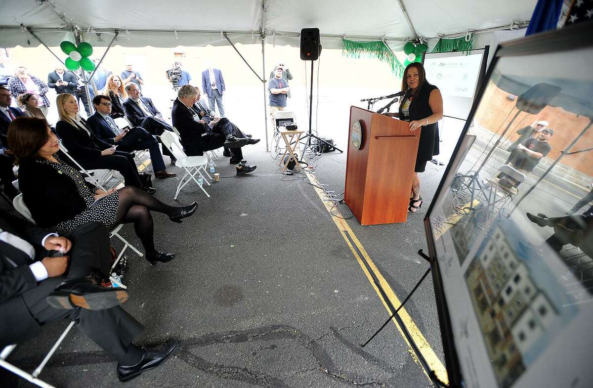 Bridgeport Neighborhood Trust CEO Elizabeth Torres addresses the groundbreaking ceremony for the Westgate Apartments in 2016. This week, BNT announced it was secured funding for another development in the neighborhood.