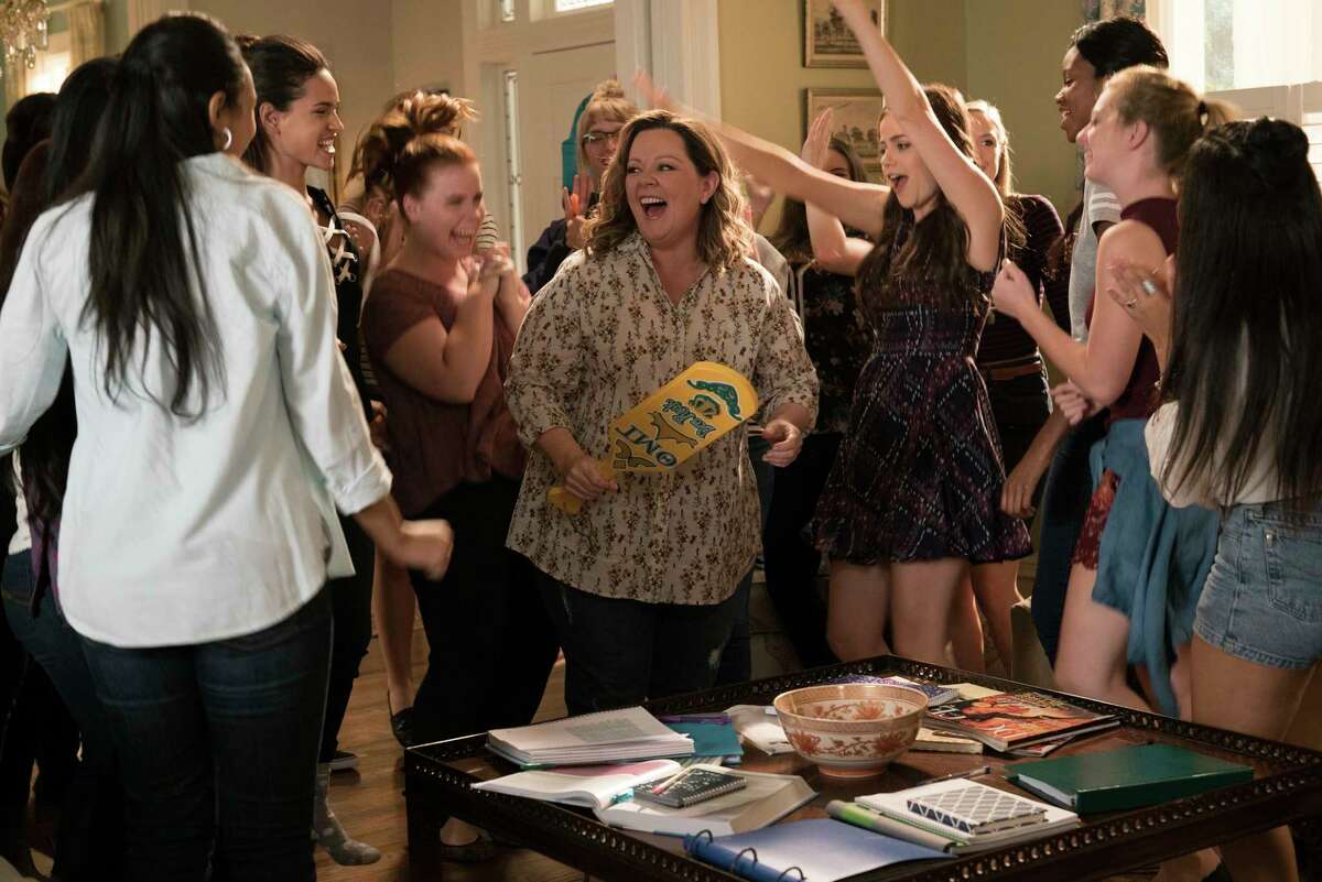 This image released by Warner Bros. Pictures shows Melissa McCarthy, center, in a scene from the comedy "Life of the Party," in theaters on May 11. (Hopper Stone/Warner Bros. Pictures via AP)
