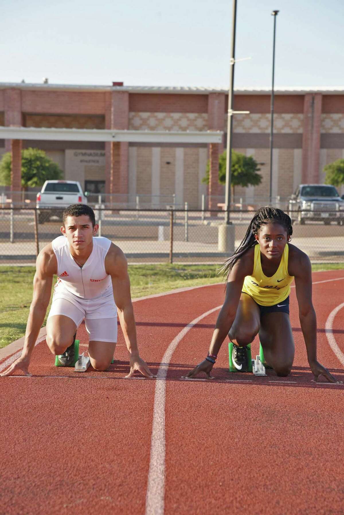 United's Alex Tirado and Alexander's Cynthia Emeremnu will compete in the 100-meter dash this weekend at the 2018 Track & Field State Meet in Austin. Tirado will also be a part of the Longhorns’ 4x100-meter relay. They posed for photos at the United High School track, Wednesday, May 9, 2018.