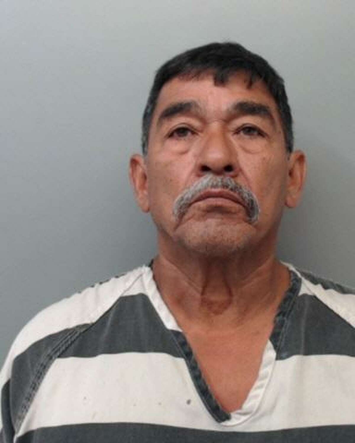 Rodolfo Flores-Ramos, 62, was charged with displaying harmful material to a minor.