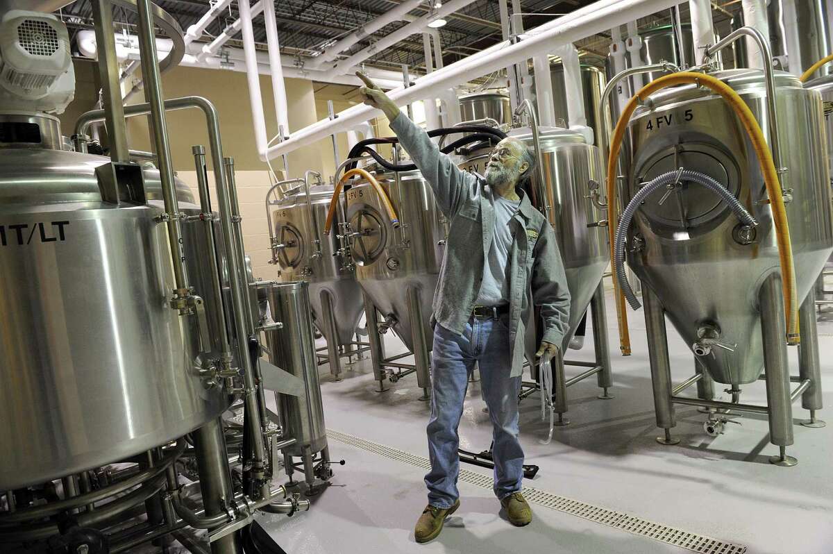 Scott Vallely, owner and brewer for the Charter Oak Brewing Co. on Shelter Rock Road in Danbury, explains the beer-making process Tuesday.