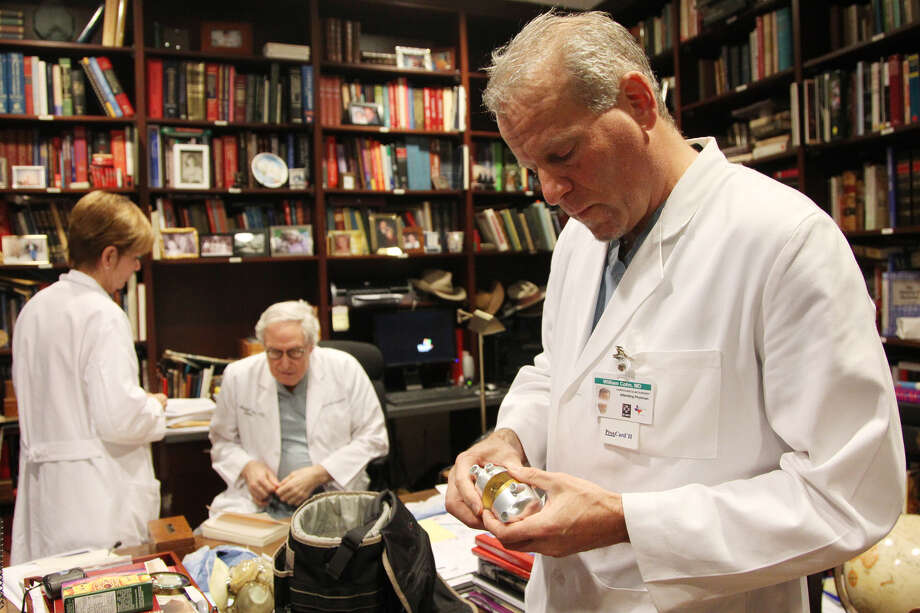 Dr. Billy Cohn holds an artificial heart while while visiting the office of Dr. O.H. "Bud" Frazier at St. Luke's Episcopal Hospital Jan. 9, 2013. Photo: Mayra Beltran