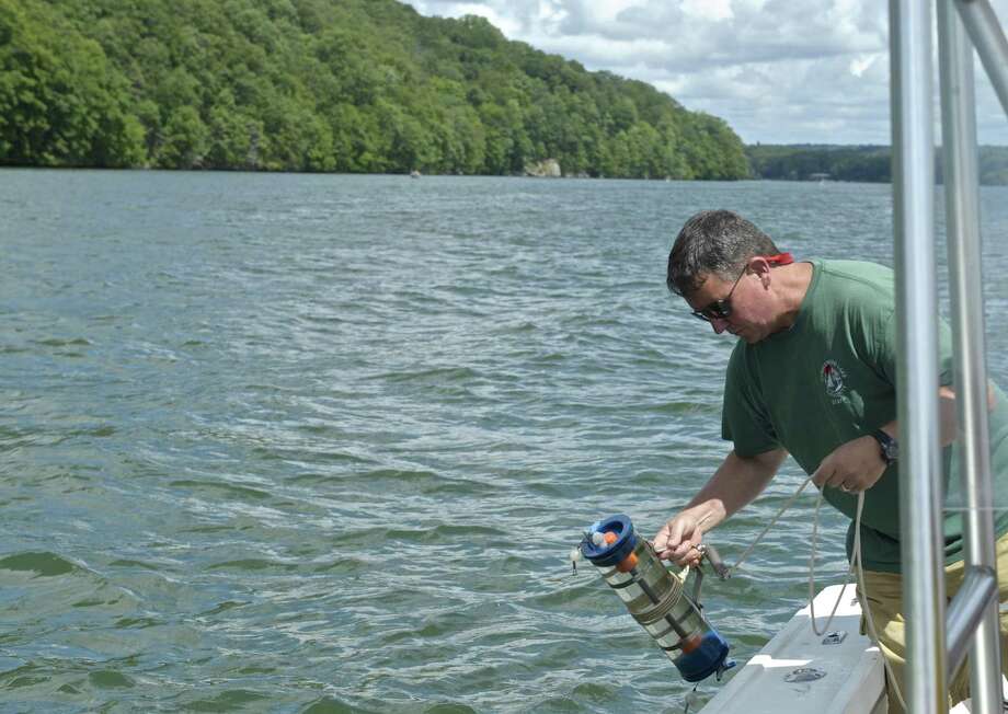File photo of Larry Marsicano, the former executive director of the Candlewood Lake Authority, testing the water quality of Candlewood Lake. Photo: H John Voorhees III / Hearst Connecticut Media / The News-Times