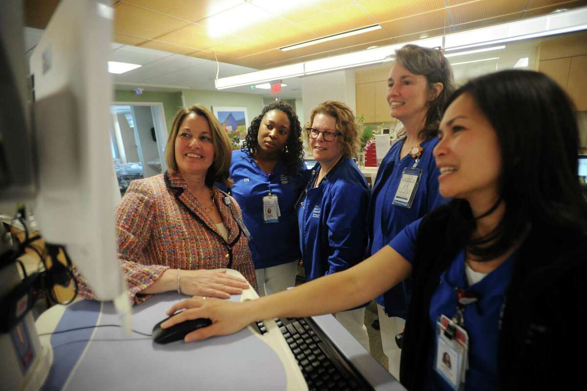 Bridgeport Hospital Senior Vice President and Chief Nursing Officer MaryEllen Hope Kosturko, left, meets with nurses in a medical surgical unit at the hospital in Bridgeport, Conn. on Wednesday, May 9, 2018.