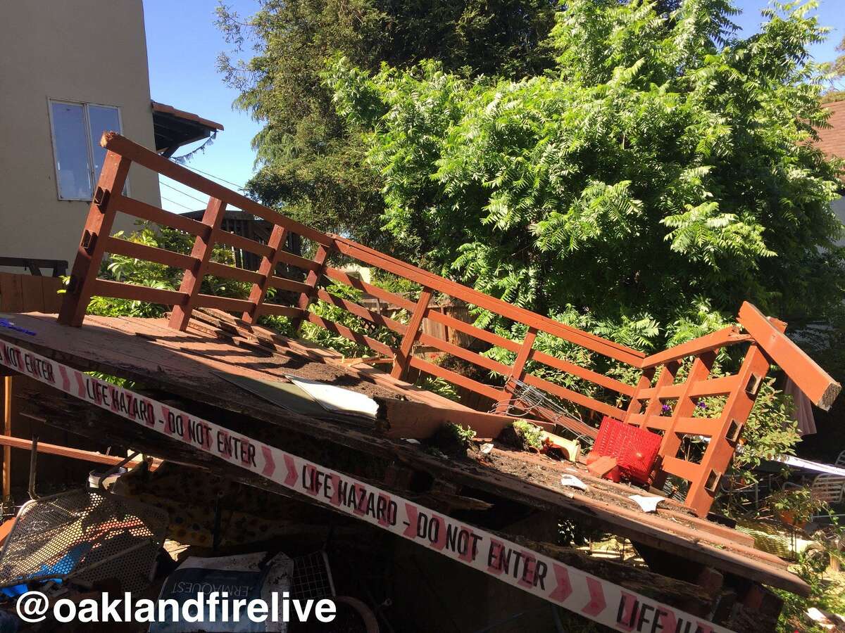 Two people were taken to a trauma center for injuries sustained when a patio collapsed in Oakland, officials said.