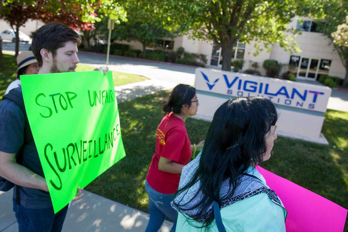Sacred Heart Community Services activist hold a protest picket in front of Vigilant Solutions headquarters before hand-delivering a letter urging the license-plate reader surveillance company to void their contract with Immigration and Customs Enforcement (ICE), Friday 11 May 2018 in Livermore, CA. (Peter DaSilva Special to the Chronicle)