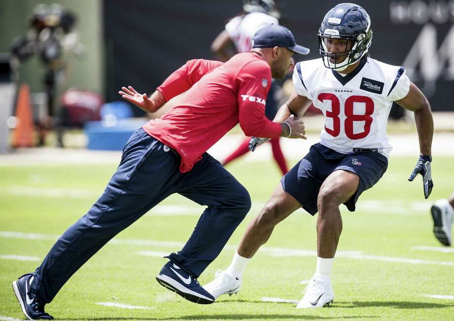 PHOTOS: Each Texans player's contract heading into 2020 offseason 
Texans assistant secondary coach D'Anton Lynn, left, works with safety Justin Reid during the rookie’s first NFL practice.
&gt;&gt;&gt;Browse through the photos for a look at the contract situation for each Houston Texans player in the 2020 NFL offseason ...  Photo: Brett Coomer, Staff / Houston Chronicle / © 2018 Houston Chronicle