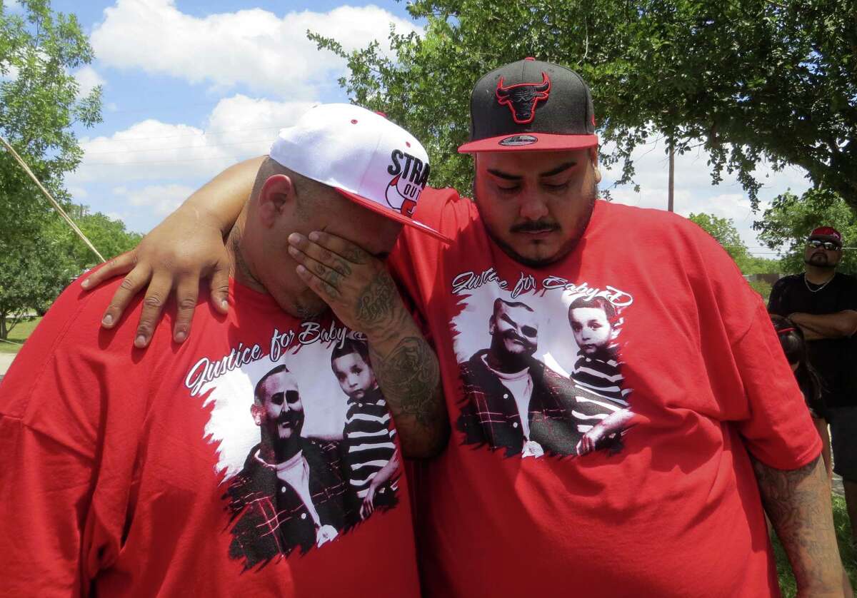 Brothers Dion (left) and Israel Rodriguez wept Friday while recalling Dion's late son, Davaughn Rodrguez, at a graveside ceremony on Friday.