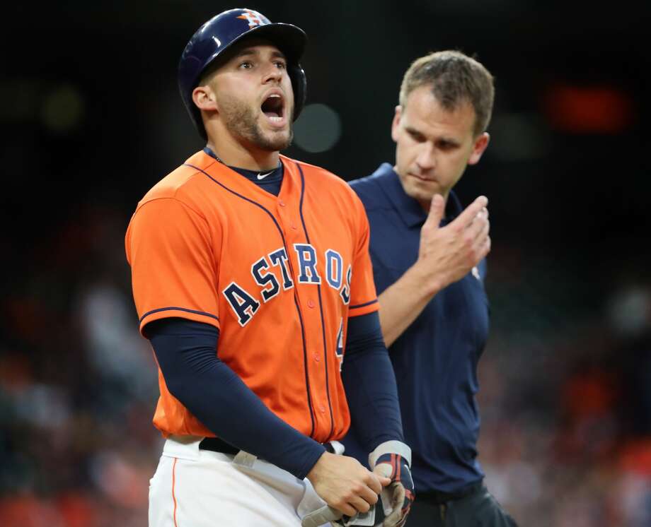 Houston Astros center fielder George Springer (4) reacts after being hit by a Texas Rangers starting pitcher Cole Hamels (35) pitch in the 3rd inning at Minute Maid Park Friday, May 11, 2018, in Houston. ( Steve Gonzales / Houston Chronicle ) Photo: Steve Gonzales/Houston Chronicle