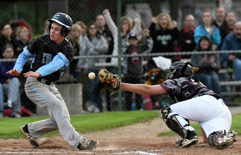 Columbia's Justin Pangburn ,left, is safe as Colonie catcher Jake Hutton drops the ball during a Section II high school baseball game Friday, May 11, 2018, in Colonie, N.Y. (Hans Pennink / Special to the Times Union) Photo: Hans Pennink / Hans Pennink