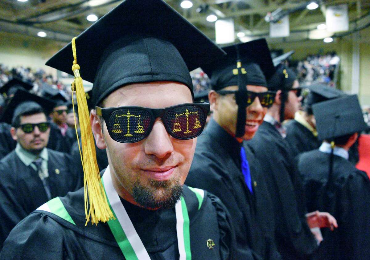 Enrollment at SUNY community colleges fell 23 percent between 2010 and 2019. Click through the slideshow to see the decline. The schools with the smallest decreases appear first. Source: SUNY Analysis: Times Union Hudson Valley Community College criminal justice graduate Brandon Ambrosino of Fonda sports a pair of Scales of Justice shades during Commencement Saturday May 12, 2018 in Troy, NY. (John Carl D'Annibale/Times Union)