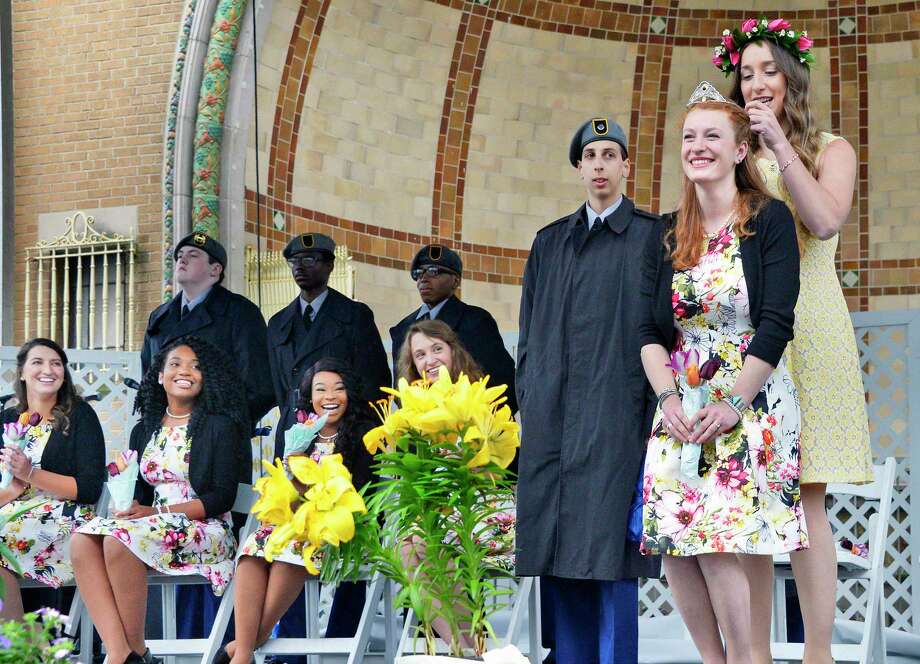 2018 Albany Tulip Queen Sawyer Cresap, 23, of Albany, is crowned by last year's Tulip Queen Ashley Loggins, top right, during the 70th Annual Tulip Festival in Washington Park Saturday May 12, 2018 in Albany, NY.  (John Carl D'Annibale/Times Union) Photo: John Carl D'Annibale, Albany Times Union / 20043718A