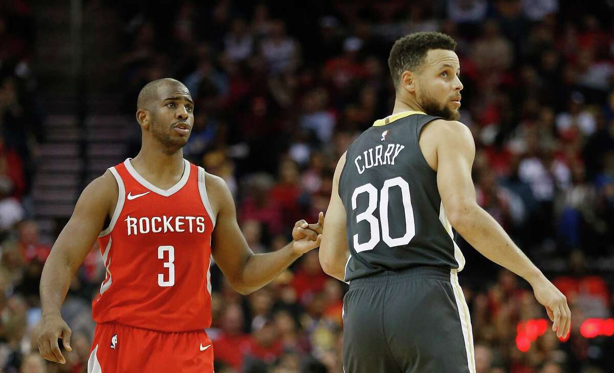 HOUSTON, TX - JANUARY 20: Chris Paul #3 of the Houston Rockets and Stephen Curry #30 of the Golden State Warriors at Toyota Center on January 20, 2018 in Houston, Texas. NOTE TO USER: User expressly acknowledges and agrees that, by downloading and or using this photograph, User is consenting to the terms and conditions of the Getty Images License Agreement. (Photo by Bob Levey/Getty Images)