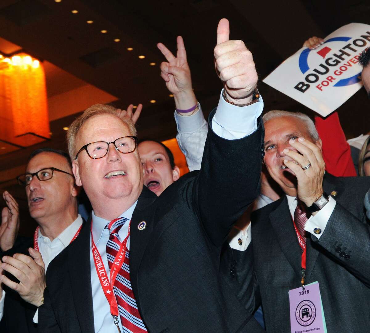 Danbury Mayor Mark Boughton, center, reacts after surpassing 50% of the delegate votes, enough needed to win the unofficial nomination as the Republican candidate for Governor during the Republican State Convention at Foxwoods Casino, Mashantucket, Conn., Saturday, May 12, 2018.