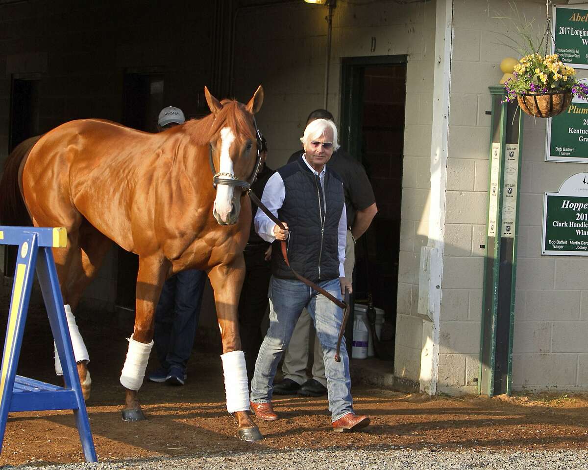Justify, led by trainer Bob Baffert, emerges from Barn 33 to meet the public the morning after winning the 144th Kentucky Derby at Churchill Downs in Louisville, Ky., Sunday, May 6, 2018. (AP Photo/Garry Jones)