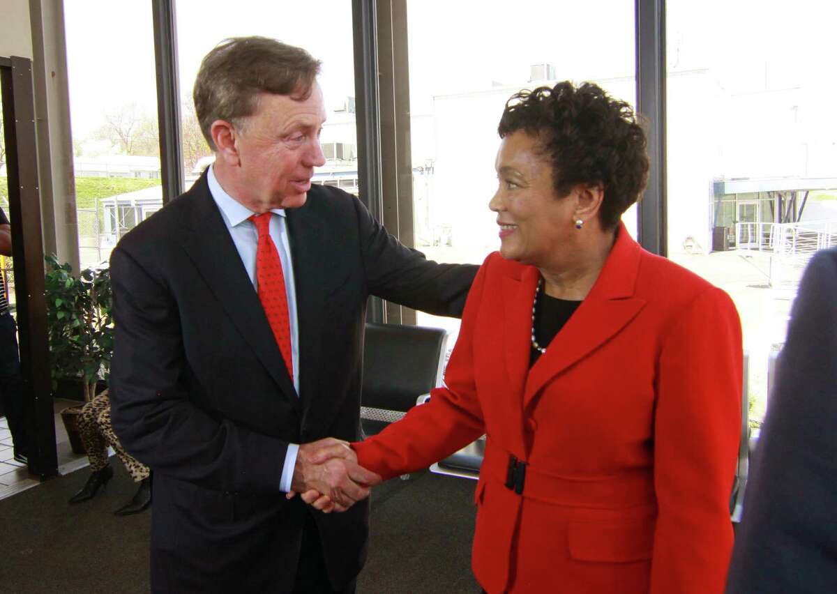 New Haven Mayor Toni Harp, right, shakes hands with democrat Ned Lamont after endorsing him in his candidacy for governor at a press conference held at Tweed Airport in New Haven, Conn., on Thursday May 3, 2018.