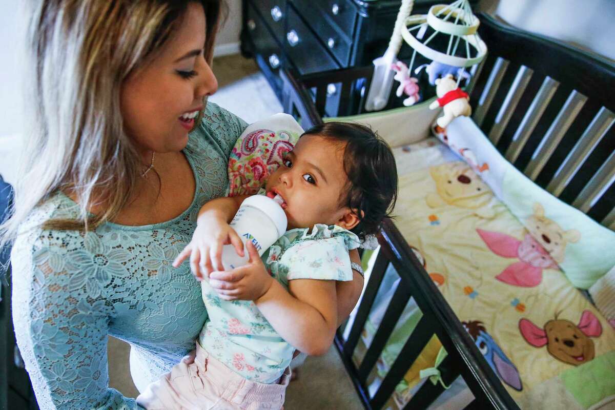 Nora Rangel holds her 15-month-old daughter Victoria Rangel while feeding her before nap time Thursday, April 26, 2018 in Houston. After Nora suffered strokes and seizures, doctors warned her that her pregnancy of Victoria was high risk and that she should abort her to save her own life. Nora decided that Victoria was too much of a miracle and at seven months pregnant had a Patent Foramen Ovale closure surgery to prevent her strokes and deliver Victoria without complications.
