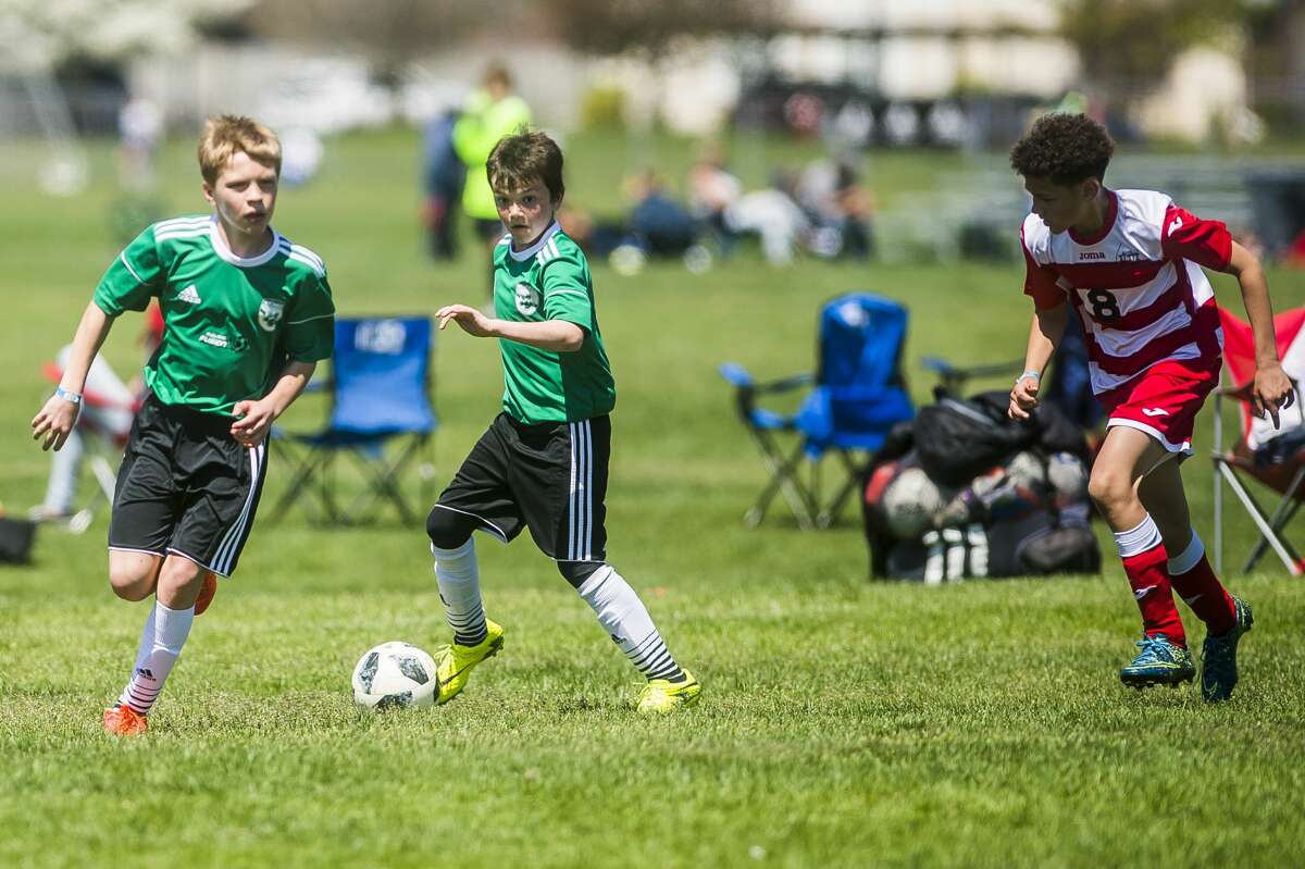 Will Trotter of Midland Fusion 06 White moves the ball down the field in a game against Holly Elite 06 in the U12 boys division during the 36th annual Midland Invitational Tournament on Sunday, May 13, 2018 at the Midland Soccer Complex.