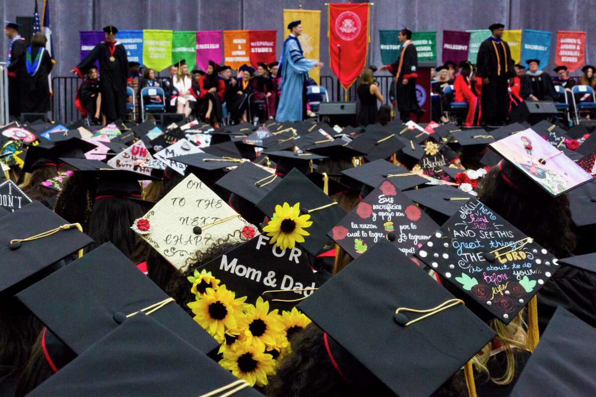 University of Houston undergraduate students wear decorated mortarboards during the commencement ceremony, Thursday, May 10, 2018, in Houston. Click through to see changes in tuition at Texas campuses.