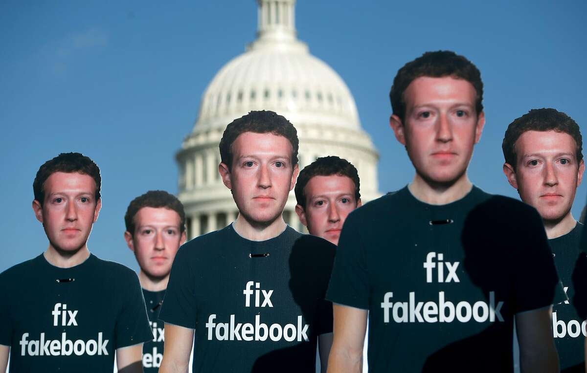 (FILES) In this file photo taken on April 10, 2018, one hundred cardboard cutouts of Facebook founder and CEO Mark Zuckerberg stand outside the US Capitol in Washington, DC. Facebook said on may 14, 2018, it has suspended "around 200" apps on its platform as part of an investigation into misuse of private user data. / AFP PHOTO / SAUL LOEBSAUL LOEB/AFP/Getty Images