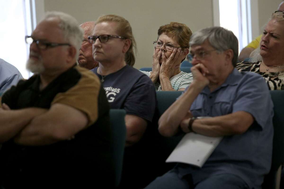 Valerie Moczygemba, center, watches a video about an active shooter situation during a Civilian Response to Active Shooter Events (CRASE) seminar held by the Wilson County Sheriff's Office at River Oaks Church in Sutherland Springs on March 22, 2018. Stephen Willeford, far left, the man who shot and chased gunman Devin Kelley at First Baptist Church of Sutherland Springs last November, also attended the event.