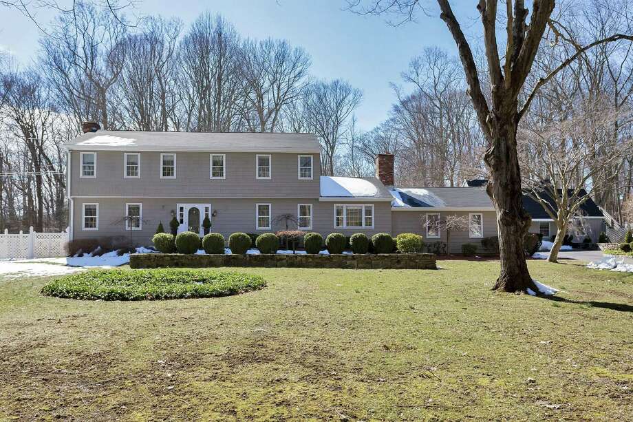 The gray shingle Garrison colonial house at 2745 Burr Street sits on a two-acre property and is close enough to the Connecticut Audubon Society on Burr Street to enjoy its acreage and assets.