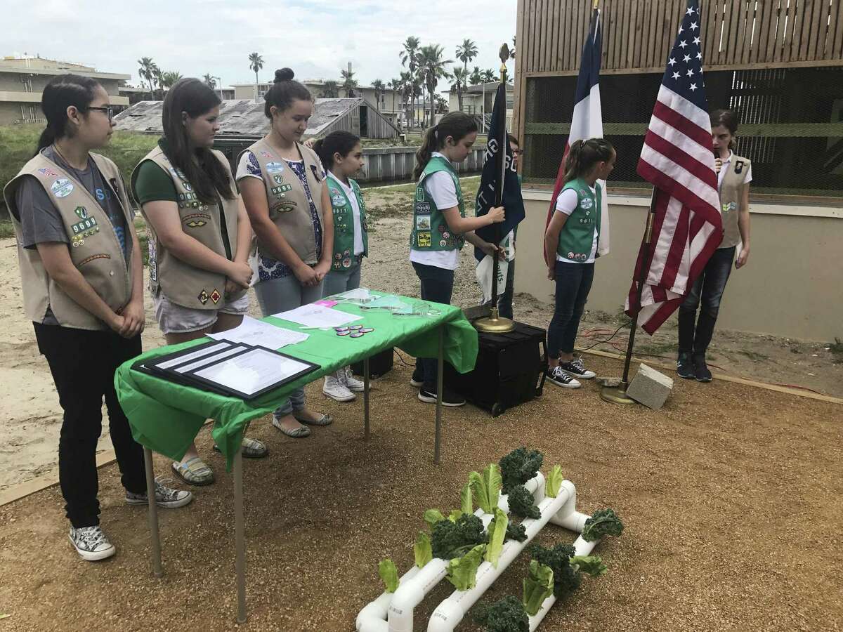In this undated photo, members of Girl Scouts organized and staged a dedication ceremony at the Amos Rehabilitation Keep as part of their Silver Award project in Port Aransas, Texas. The Girl Scouts builds women leaders.